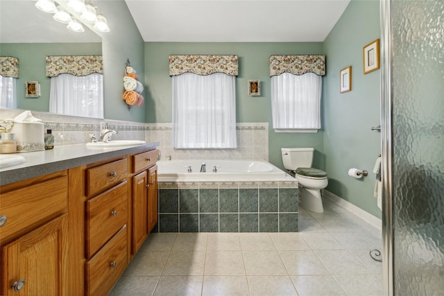 full bath with toilet, a bath, tile patterned floors, and vanity