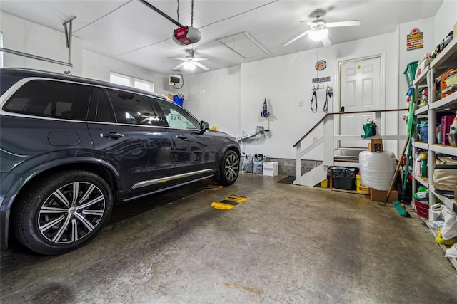 garage with ceiling fan and a garage door opener