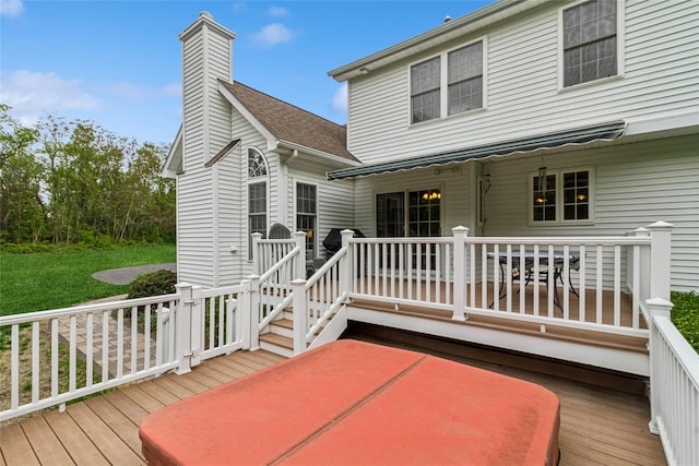 wooden terrace with a yard