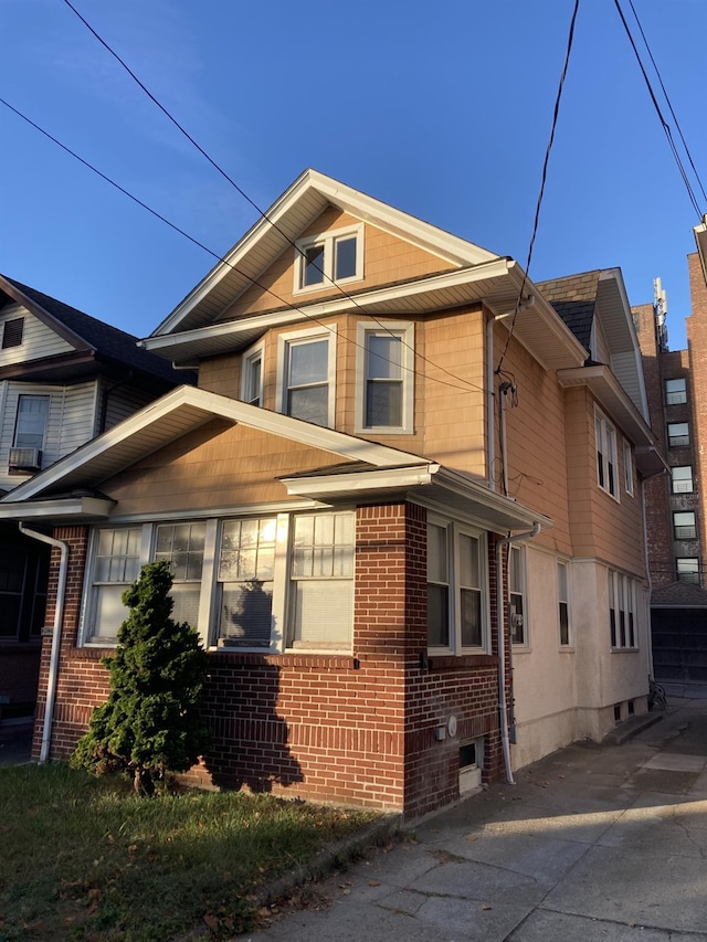 view of property exterior with brick siding