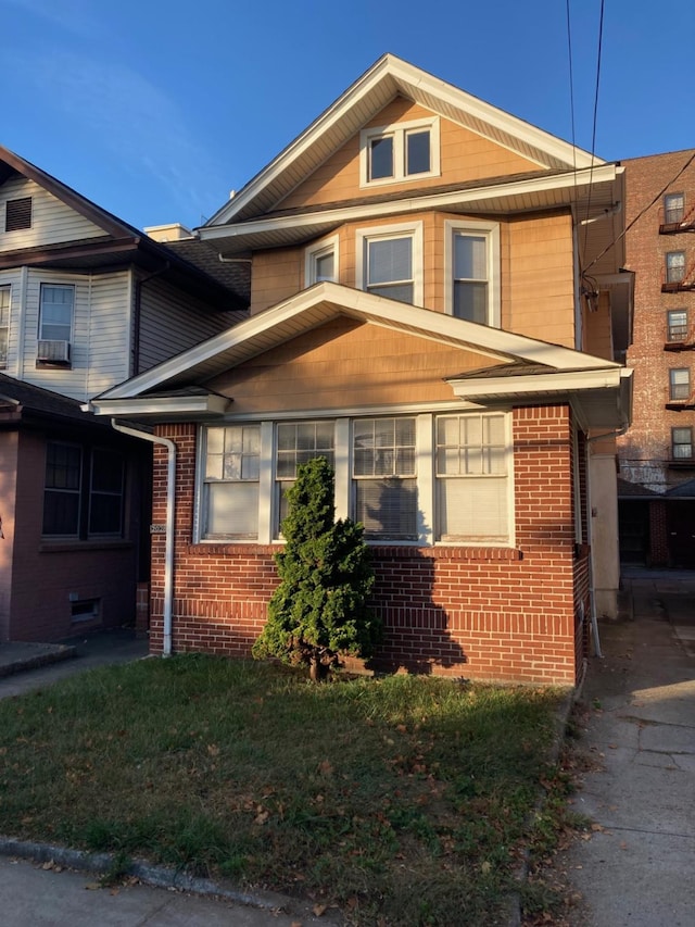 view of front of home featuring brick siding