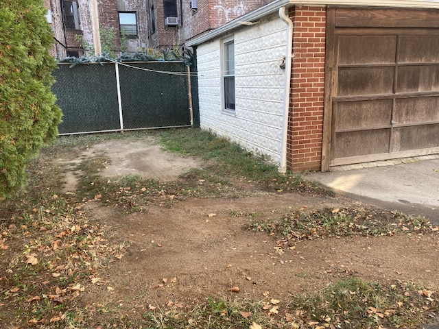 view of side of home featuring brick siding