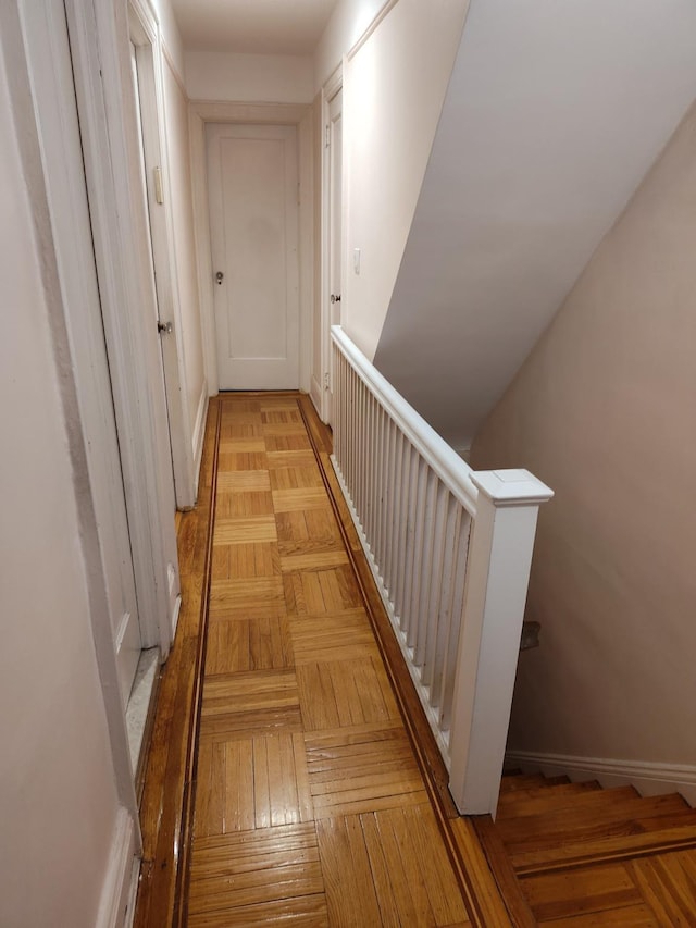 hall featuring baseboards