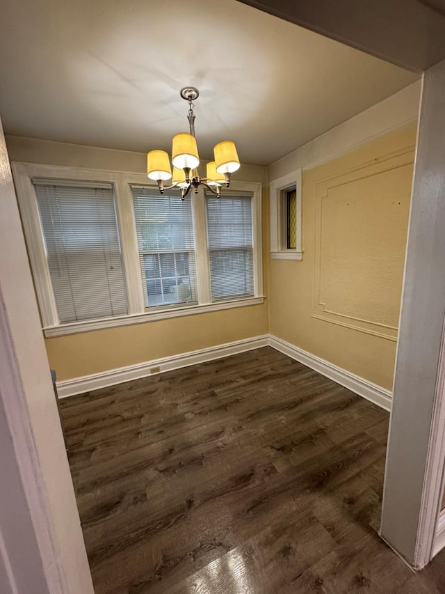 19-11 147th St, Flushing, NY 11357 - unfurnished dining area featuring a chandelier, baseboards, and dark wood-style flooring