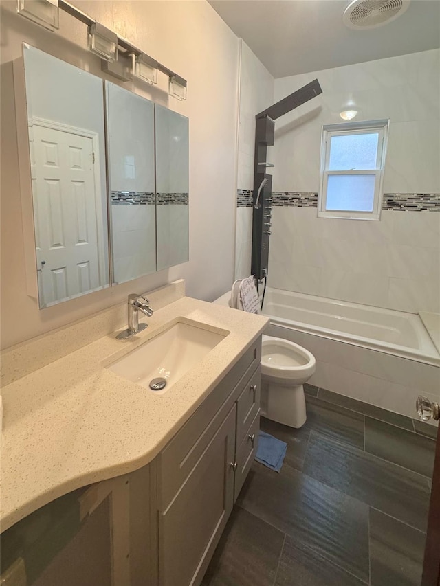 19-11 147th St, Flushing, NY 11357 - bathroom with tiled shower / bath, toilet, and vanity