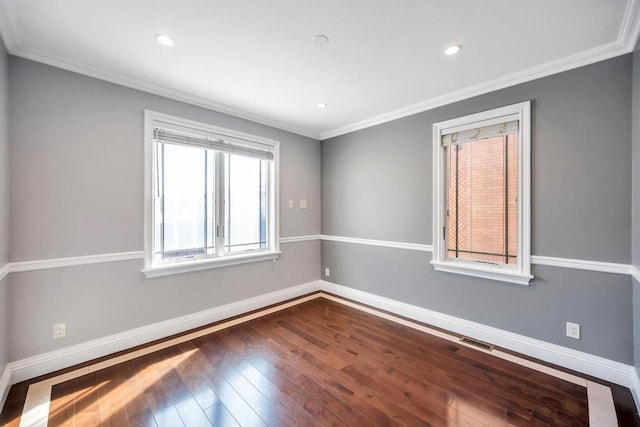 unfurnished room with baseboards, wood-type flooring, crown molding, and recessed lighting
