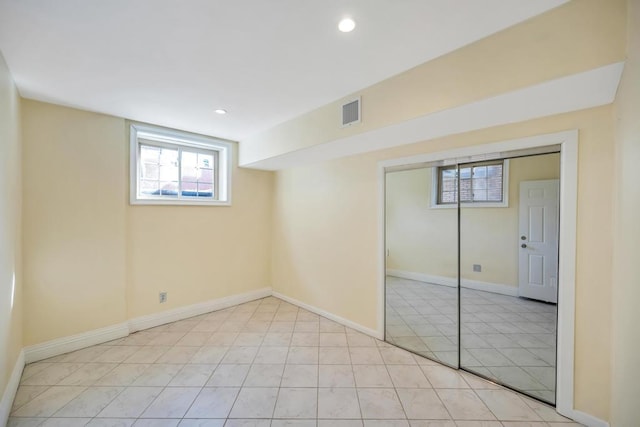 basement featuring baseboards and recessed lighting