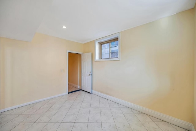 empty room with baseboards and recessed lighting