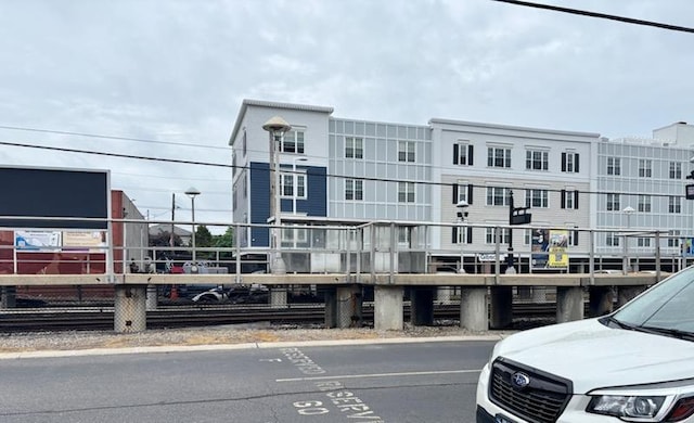 view of property featuring uncovered parking