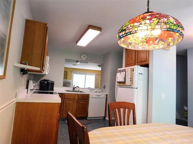 42 Touchstone Way, Millwood, NY 10546 - kitchen featuring white appliances, brown cabinets, light countertops, and pendant lighting