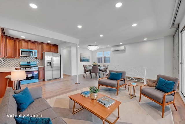 15940 95th St, Howard Beach, NY 11414 - living room with a wall mounted air conditioner, light wood-style floors, recessed lighting, baseboards, and a chandelier