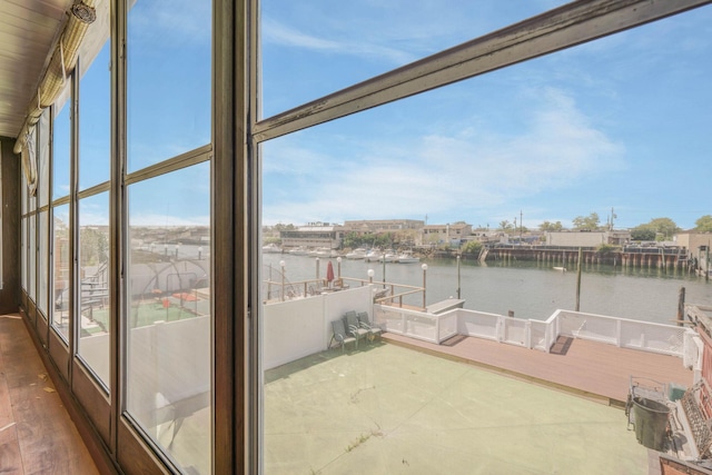 15940 95th St, Howard Beach, NY 11414 - unfurnished sunroom featuring a water view