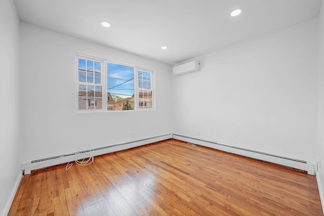 15940 95th St, Howard Beach, NY 11414 - unfurnished room featuring wood finished floors, a wall unit AC, recessed lighting, and baseboard heating