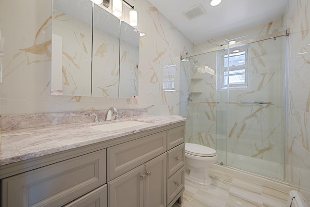 15940 95th St, Howard Beach, NY 11414 - full bath featuring toilet, a marble finish shower, and vanity