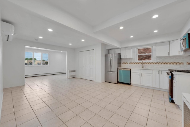 15940 95th St, Howard Beach, NY 11414 - kitchen featuring appliances with stainless steel finishes, a sink, a wall mounted air conditioner, recessed lighting, and decorative backsplash