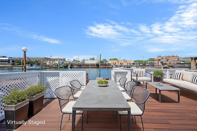 15940 95th St, Howard Beach, NY 11414 - wooden terrace featuring a water view and an outdoor hangout area