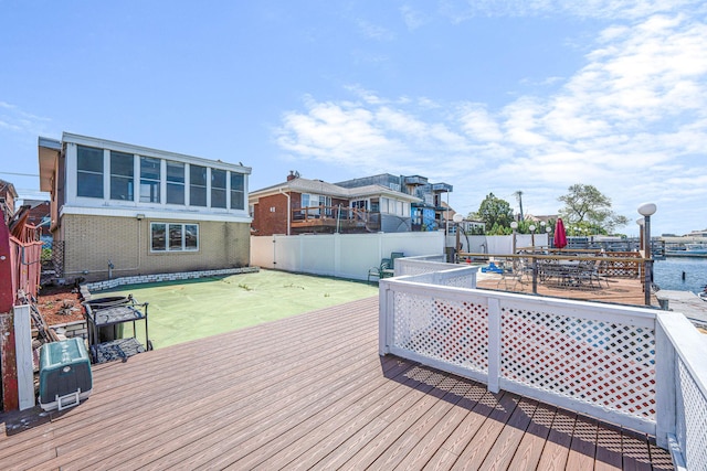15940 95th St, Howard Beach, NY 11414 - wooden terrace with a fenced backyard