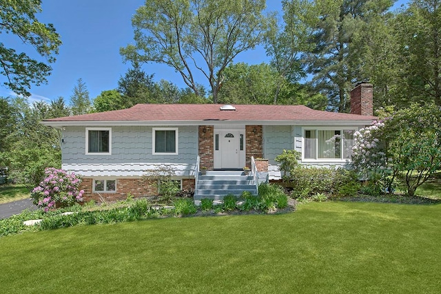 23 Pineview Rd, Mount Kisco, NY 10549 - view of front of property featuring a chimney and a front yard