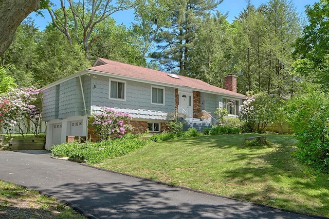 23 Pineview Rd, Mount Kisco, NY 10549 - ranch-style house with a chimney, a garage, a front lawn, driveway, and brick siding