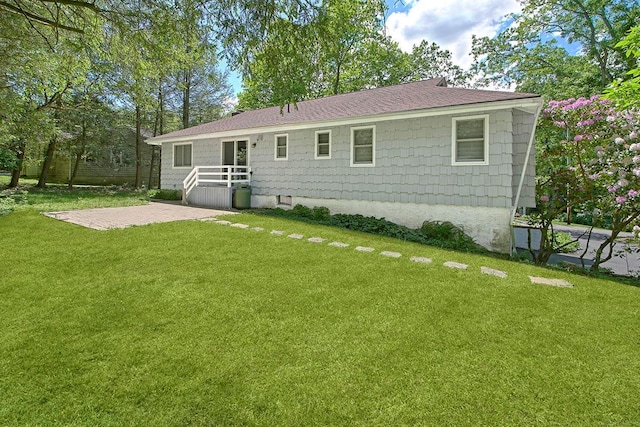23 Pineview Rd, Mount Kisco, NY 10549 - rear view of house featuring a yard, a patio area, and roof with shingles