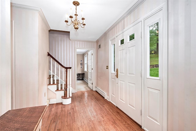 3 Kitchel Rd, Mount Kisco, NY 10549 - foyer entrance featuring crown molding, a baseboard radiator, a chandelier, stairway, and light wood-style flooring
