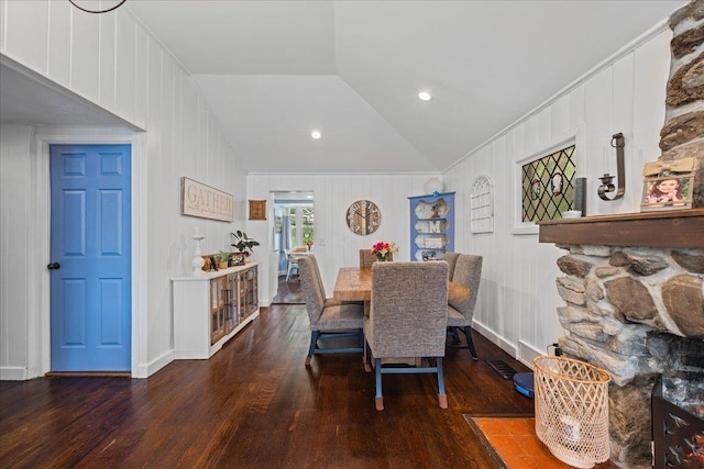 dining room featuring hardwood / wood-style flooring and lofted ceiling