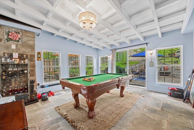 game room featuring stone tile flooring, beam ceiling, and billiards table