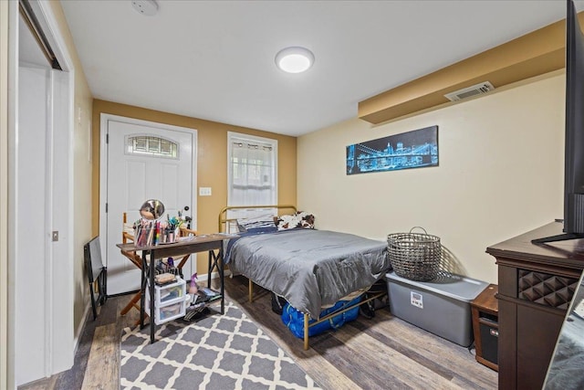 bedroom with wood finished floors