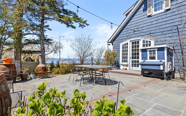 view of patio / terrace featuring outdoor dining area and fence