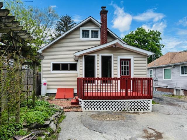 1358 Rte 44, Pleasant Valley, NY 12569 - back of house with a wooden deck, a chimney, and fence