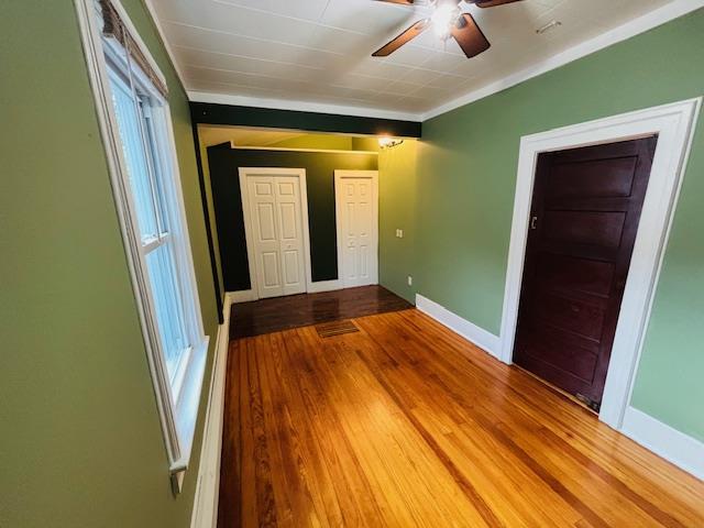 1358 Rte 44, Pleasant Valley, NY 12569 - unfurnished room with ceiling fan, baseboards, wood finished floors, ornamental molding, and plenty of natural light