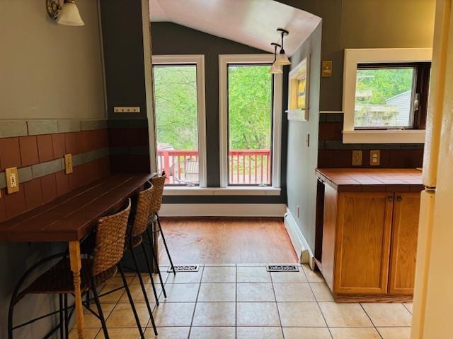 1358 Rte 44, Pleasant Valley, NY 12569 - unfurnished dining area featuring vaulted ceiling and light tile patterned flooring