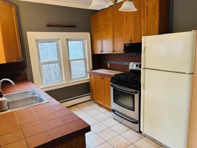 1358 Rte 44, Pleasant Valley, NY 12569 - kitchen with freestanding refrigerator, stainless steel gas range, tile counters, and a baseboard radiator