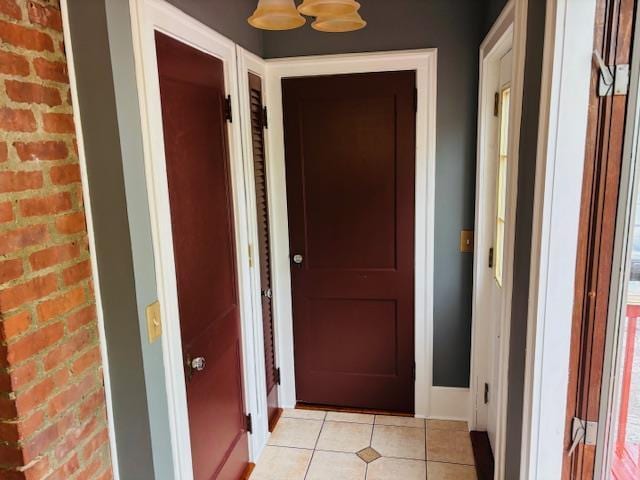 1358 Rte 44, Pleasant Valley, NY 12569 - corridor featuring light tile patterned floors, baseboards, and brick wall