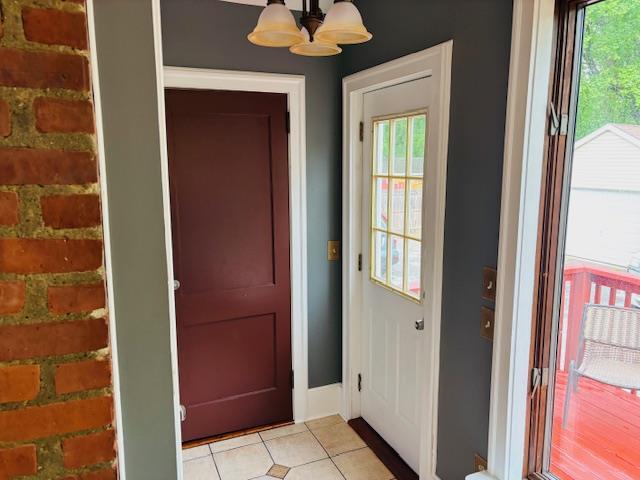1358 Rte 44, Pleasant Valley, NY 12569 - entryway with healthy amount of natural light, a chandelier, and light tile patterned floors
