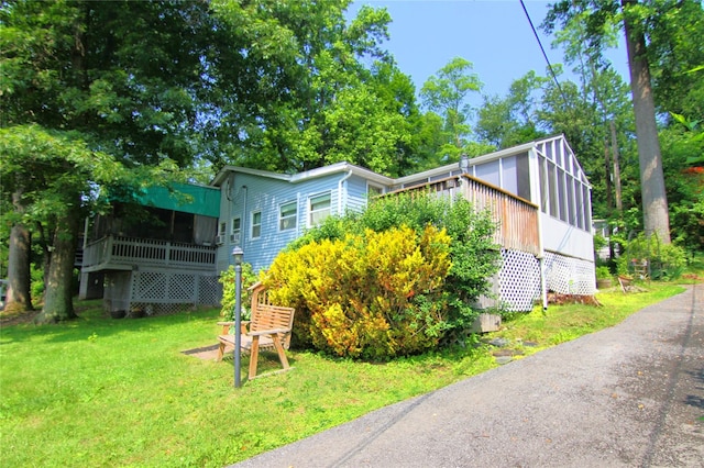 191 Sylvan Lake Rd Unit 16, Hopewell Junction, NY 12533 - view of front of house featuring a front lawn and a deck