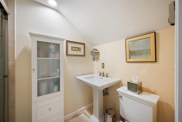 41 Heritage Hills Dr Unit A, Somers, NY 10589 - full bath with lofted ceiling, toilet, a textured ceiling, and a shower with door