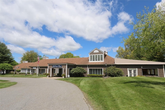 41 Heritage Hills Dr Unit A, Somers, NY 10589 - view of front facade with a chimney, a front lawn, and french doors