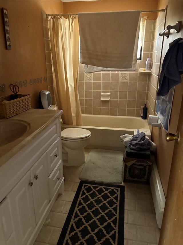 bathroom featuring toilet, shower / bath combination with curtain, vanity, and tile patterned floors