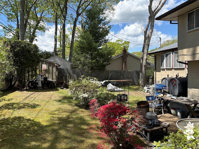 view of yard with an outdoor structure and a shed