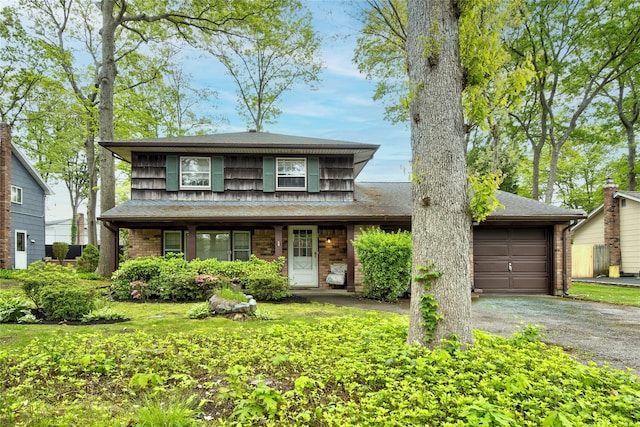 76 Moriches Rd, Lake Grove, NY 11755 - view of front of home with driveway, an attached garage, brick siding, a shingled roof, and covered porch