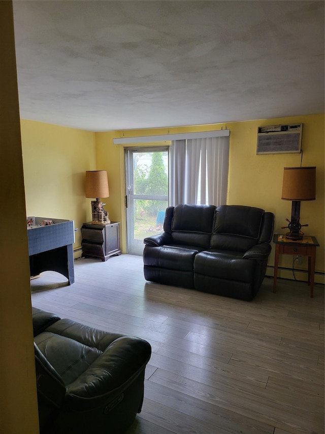 76 Moriches Rd, Lake Grove, NY 11755 - living area with baseboard heating, hardwood / wood-style floors, and an AC wall unit