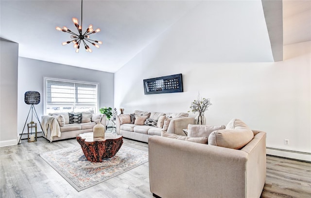 10 Butler Dr, Goshen, NY 10924 - living room with a chandelier, light wood-style flooring, high vaulted ceiling, baseboards, and a baseboard radiator