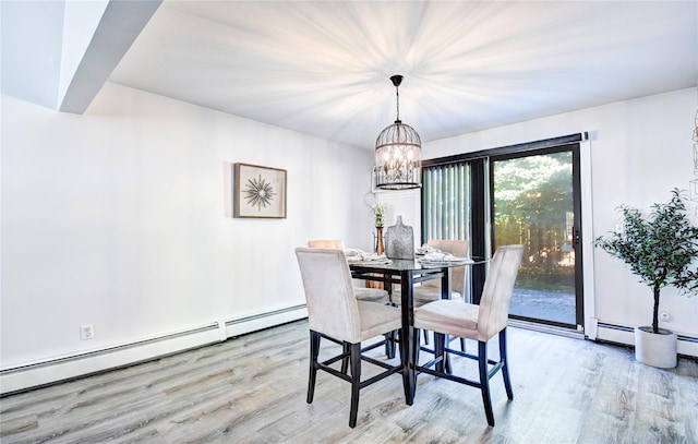 10 Butler Dr, Goshen, NY 10924 - dining area featuring a baseboard heating unit, light wood finished floors, and a chandelier