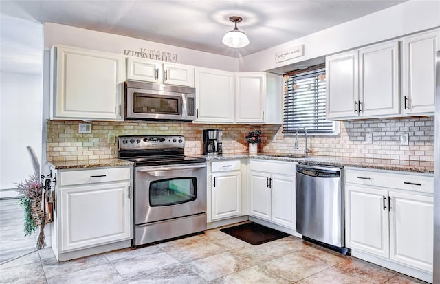 10 Butler Dr, Goshen, NY 10924 - kitchen with appliances with stainless steel finishes, a sink, white cabinets, and decorative backsplash