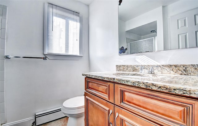 10 Butler Dr, Goshen, NY 10924 - bathroom with a baseboard radiator, a shower stall, toilet, vanity, and tile patterned floors
