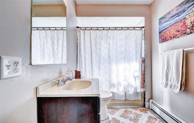 10 Butler Dr, Goshen, NY 10924 - full bathroom featuring a baseboard heating unit, plenty of natural light, vanity, and toilet