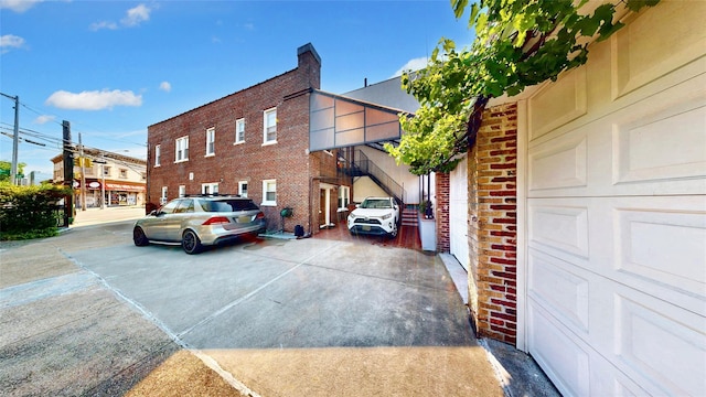 view of side of property featuring brick siding