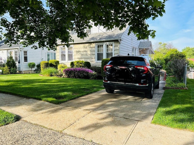 3611 204th St, Bayside, NY 11361 - view of front facade featuring a front lawn and a shingled roof