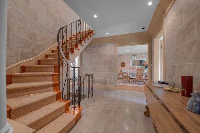 1 Wensley Dr, Great Neck, NY 11021 - staircase with tile walls and recessed lighting